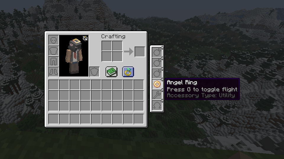 Shows the expansion of the survival inventory and the example "Angel Ring" accessory bundled within the mod